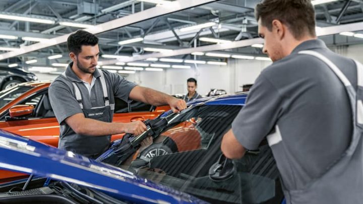 BMW experts replacing a BMW windshield.