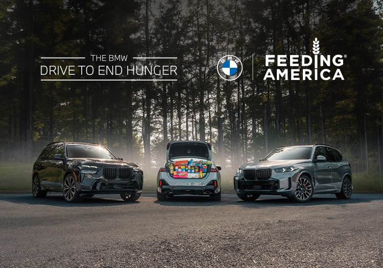 A 2025 BMW X7 xDrive40i, 540i xDrive, and X5 xDrive50e parked in a forested landscape, with the 540i xDrive's trunk open to show a large amount of grocery items.