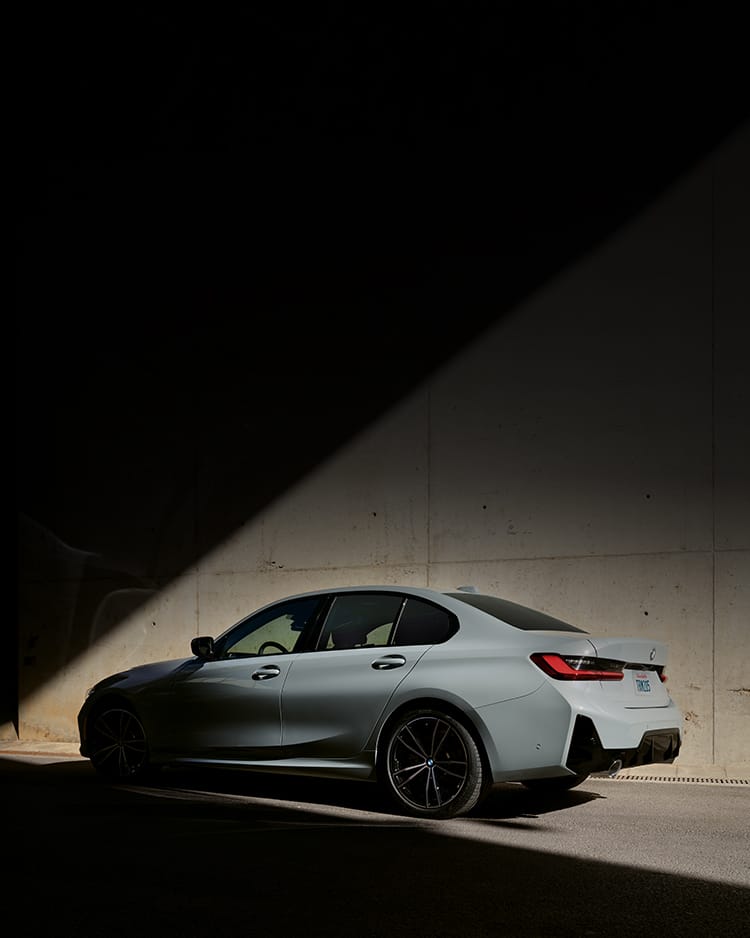 Side exterior shot of the 2024 BMW 330i in Brooklyn Grey Metallic