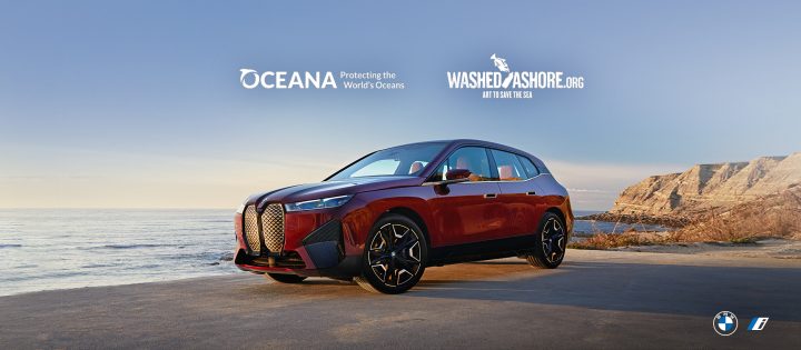 The First-Ever BMW iX Sports Activity Vehicle parked on a beach by the ocean