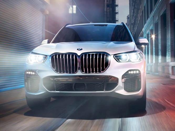 BMW Sports Activity Vehicle cruising in the city