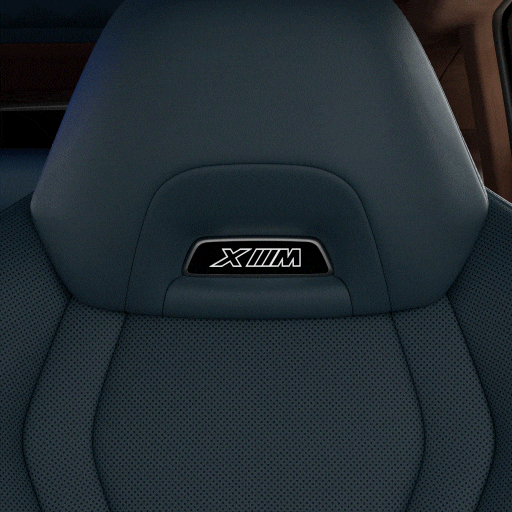 Detail of M Multi-function seats in Merino Leather with some of the cockpit and sculptural headliner showing, set against an abstract celestial background