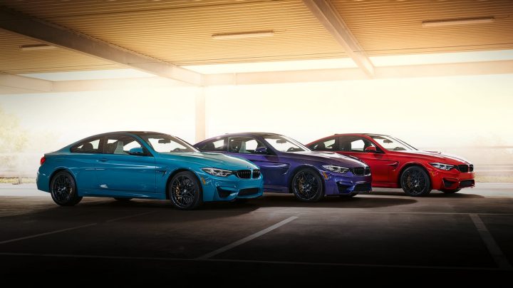 Front, side, and rear views of three BMW M4 Edition M Heritage Coupes
