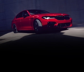 The M5 Sedan making a turn in in the shadows