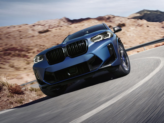 The BMW X3 M shows off its cornering abilities on a drive through the desert