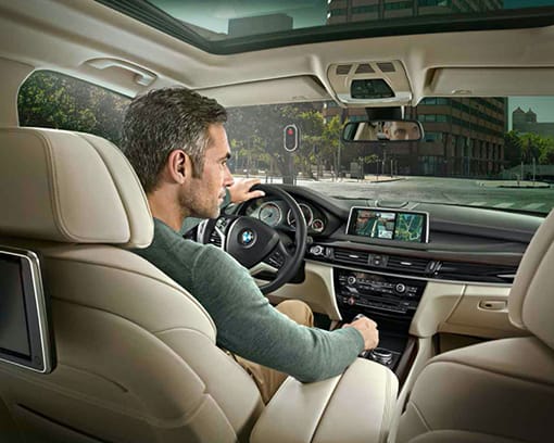 Interior shot of a man driving a Certified Pre-Owned BMW