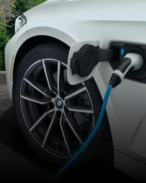 Exterior shot of the BMW i3 all-electric sedan charging