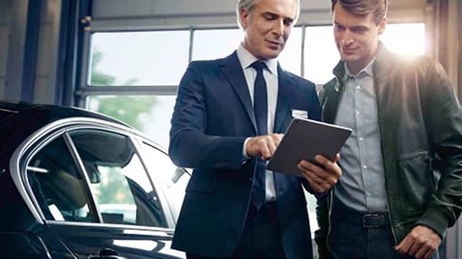 Image of BMW representative speaking with a customer