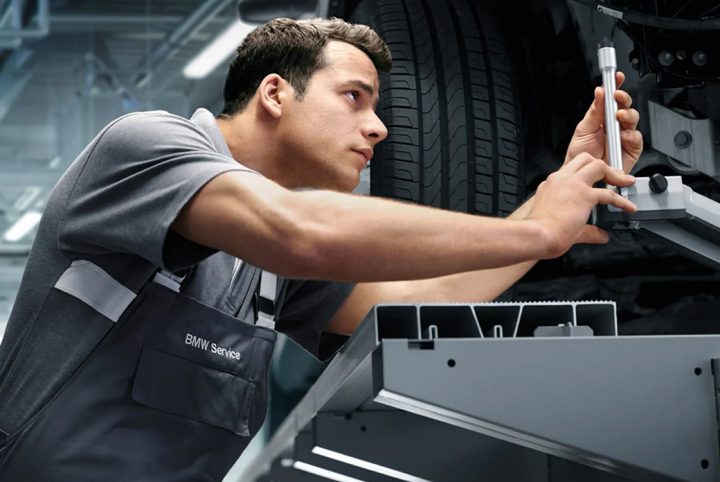 A BMW Trained Technician performing work on a BMW