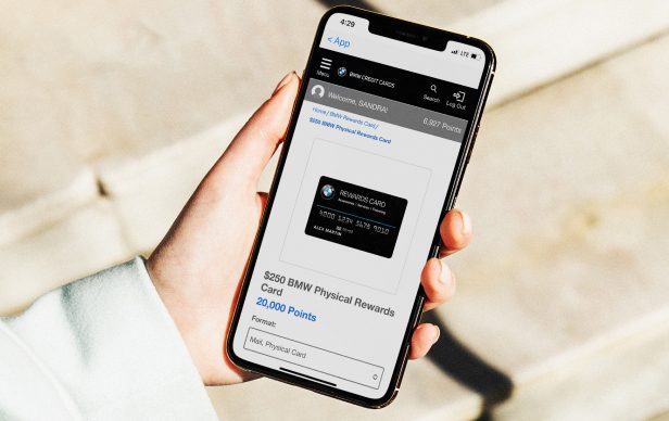 Closeup of a driver accessing the BMW Rewards Center on a smartphone