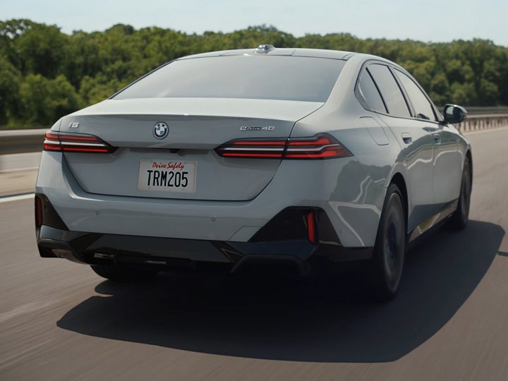 Rear shot of a BMW EV with a dramatic shadow