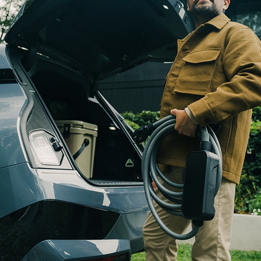 A BMW owner preparing to charge their EV