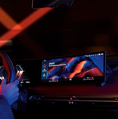 Dramatic interior shot of the Central Information Display featuring the Iconic Sounds Sport feature