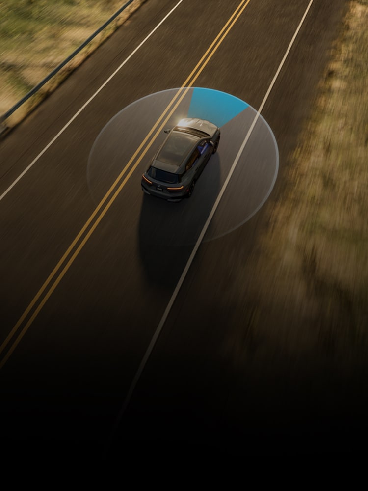 Aerial view of a BMW driving down an open road, showcasing sensor technology