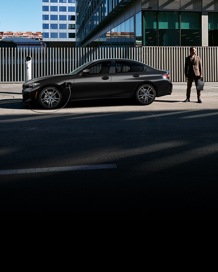 A BMW parked into a public charger