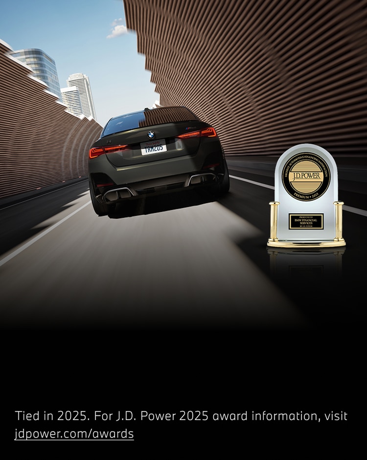 A BMW driving down a city street