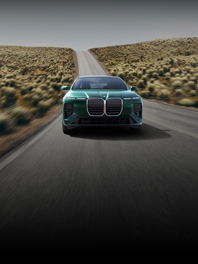 A BMW 7 Series Sedan driving down an open highway