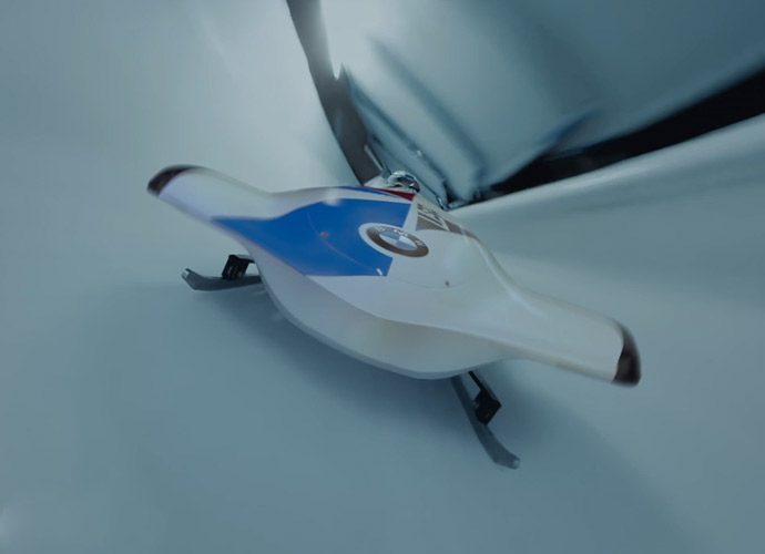 Closeup of a racer wearing a BMW helmet