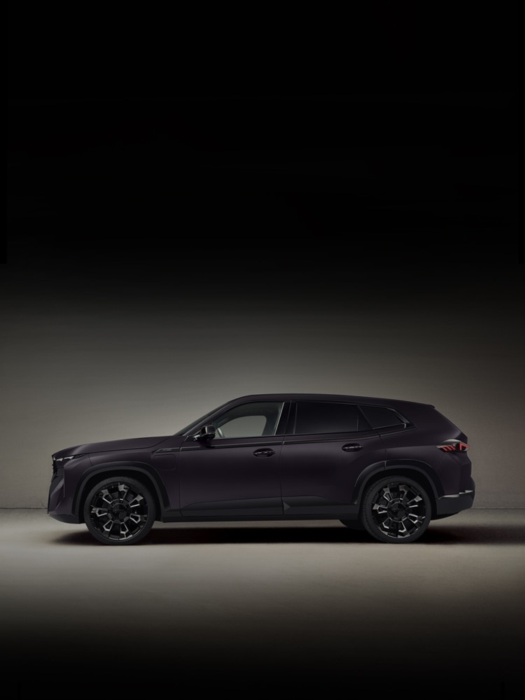 A left side profile shot of the BMW XM by Kith in frozen techno violet.