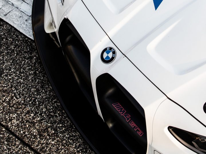Closeup of the adjustable front splitter on a BMW M4 GT3