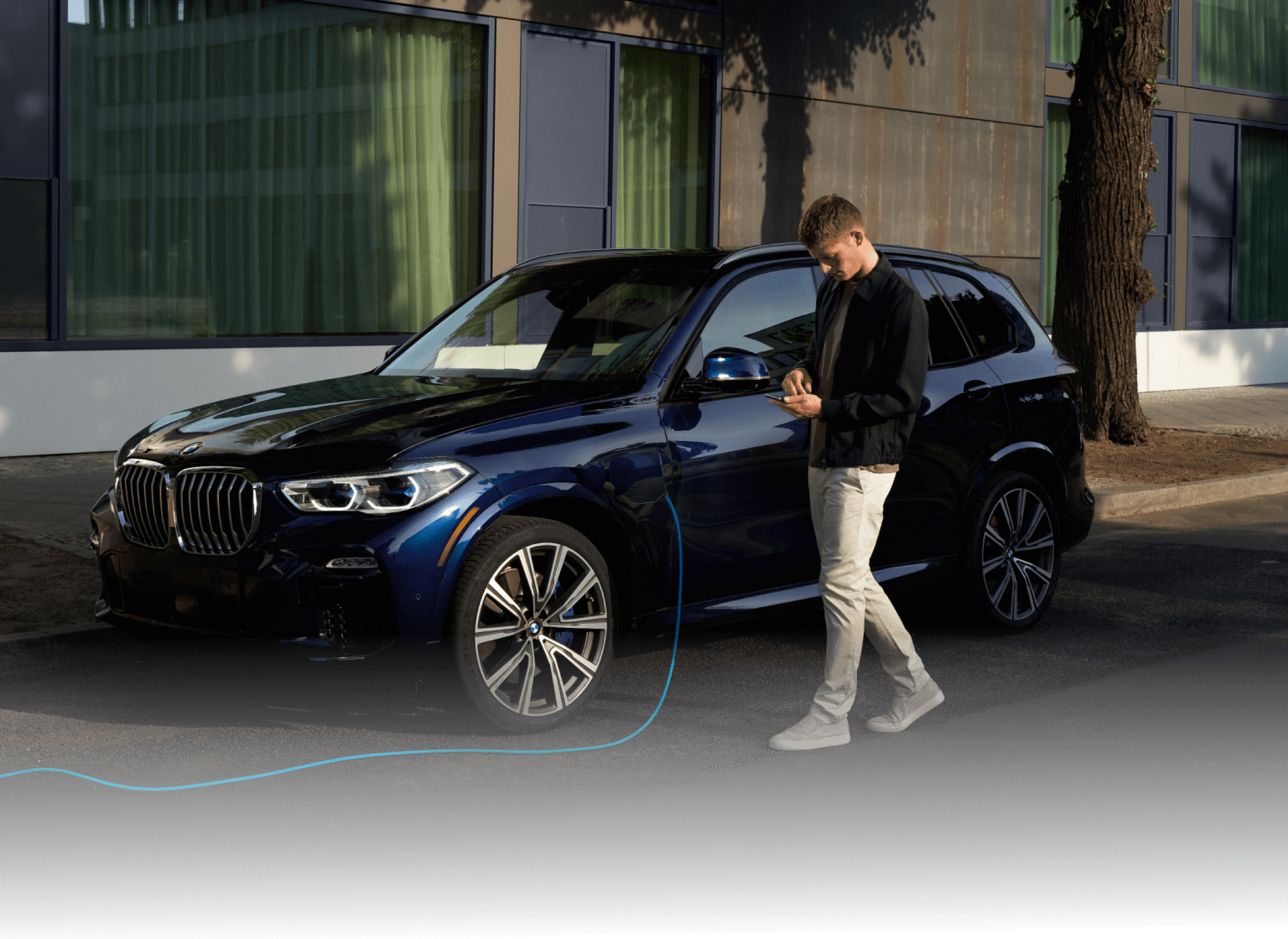 BMW Driver using My BMW App while his BMW is charging
