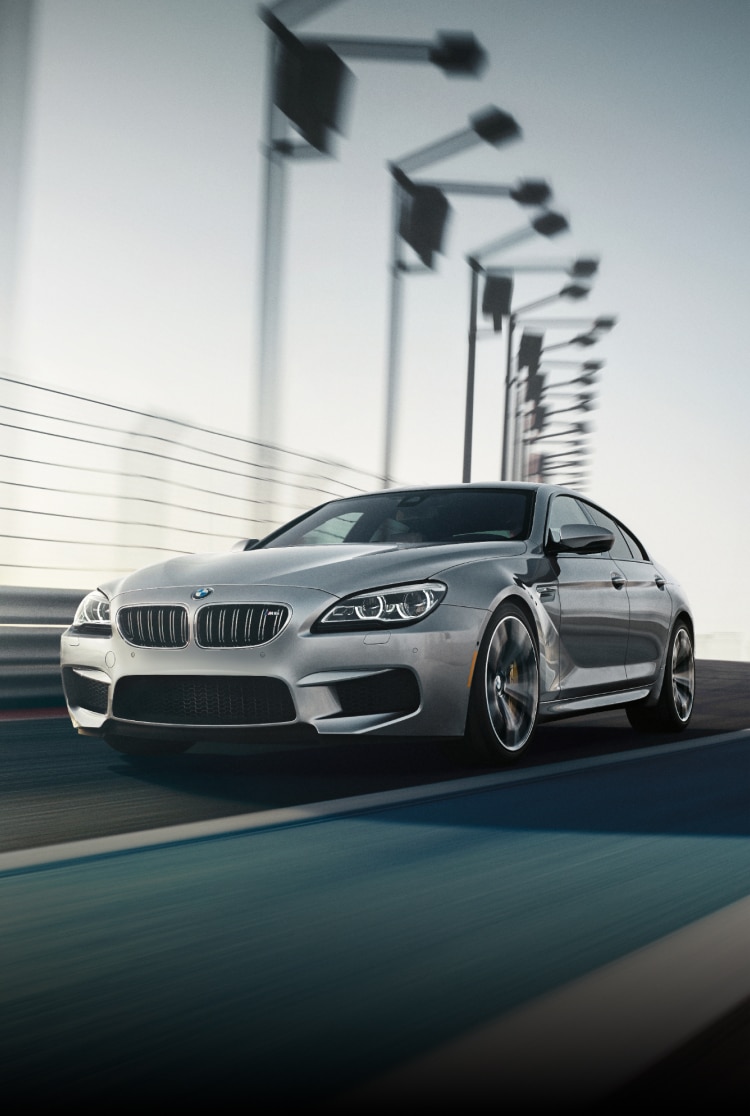 Dymamic shot of the BMW M6 Gran Coupe driving on a bridge