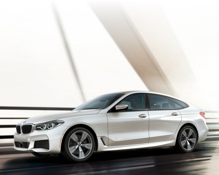 Side profile shot of the BMW6 Series Gran Turismo driving over a bridge