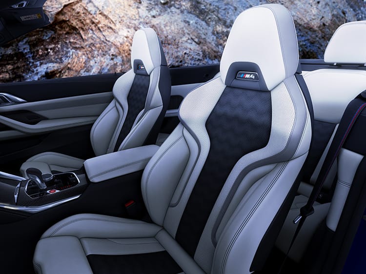Detail shot of the M Sport Seats with an illuminated M4 badge