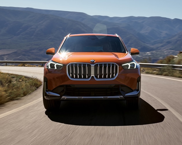 Dynamic shot of the BMW X1 driving on the road