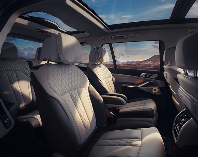 The spacious inside of a BMW X7 SUV with three rows of seats