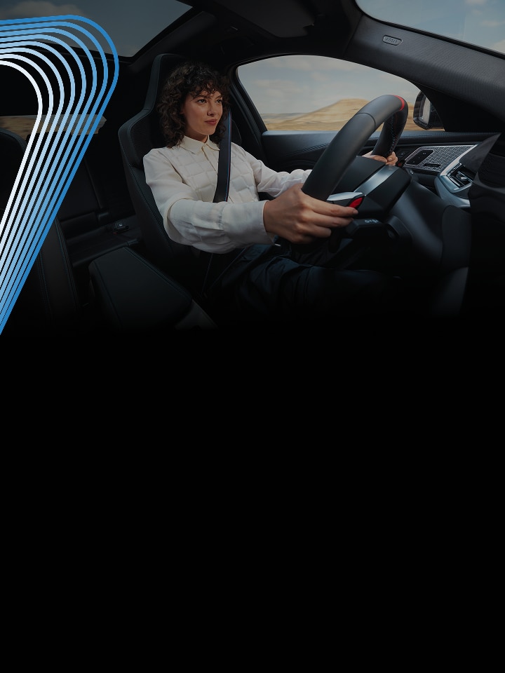 A dramatic closeup of a woman with a determined expression gripping the steering wheel of a BMW