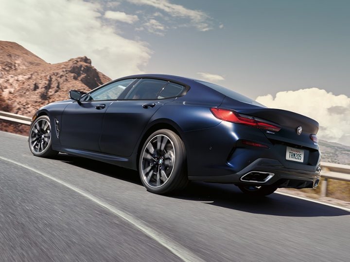 A 2026 BMW M850i xDrive Gran Coupe handles a challenging corner