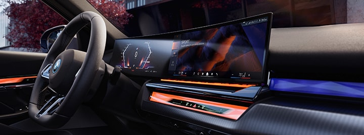 Detail of the BMW Curved Display and Interaction Bar in the BMW i5 Sedan