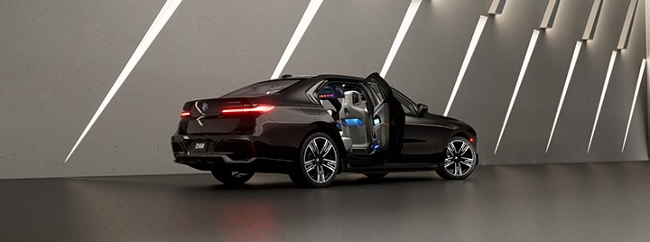 BMW i7 eDrive50 with rear door open, showcasing the stunning interior