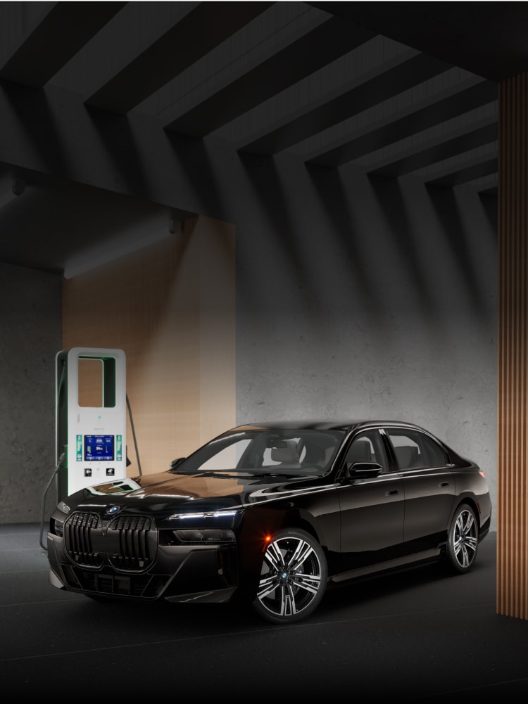 The BMW i7 eDrive50 charging up at an Electrify America public charging station