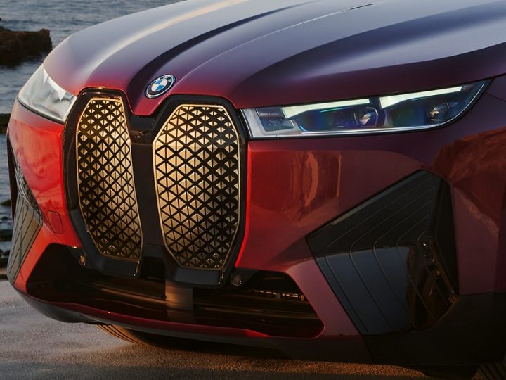 Front detail of iX xDrive50, showing available Icon Adaptive LED Headlights with Laserlight