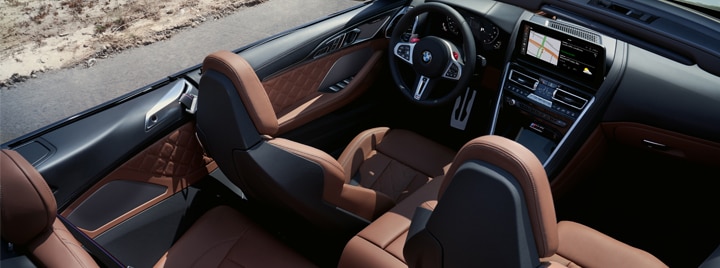 Overhead shot of the 2025 BMW M8 Competition Convertible with the top down