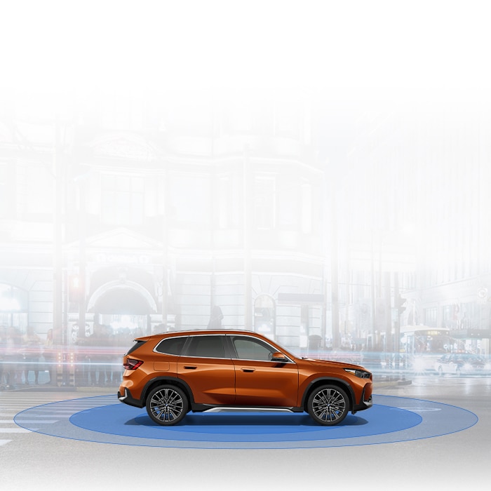 Side profile of the BMW X1 atop blue circles conveying safety technology