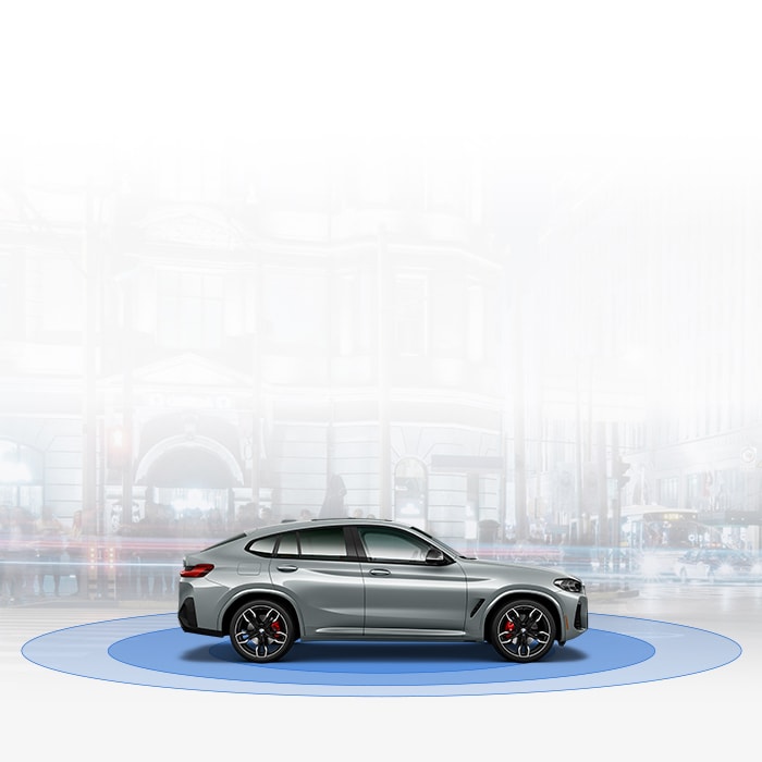 The 2025 BMW X4  sits atop blue circles conveying safety technology. A faded cityscape is in the background. 