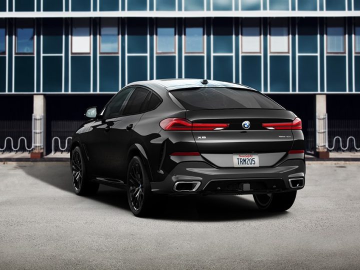 Rear view of 2026 BMW X6 parked in an urban setting
