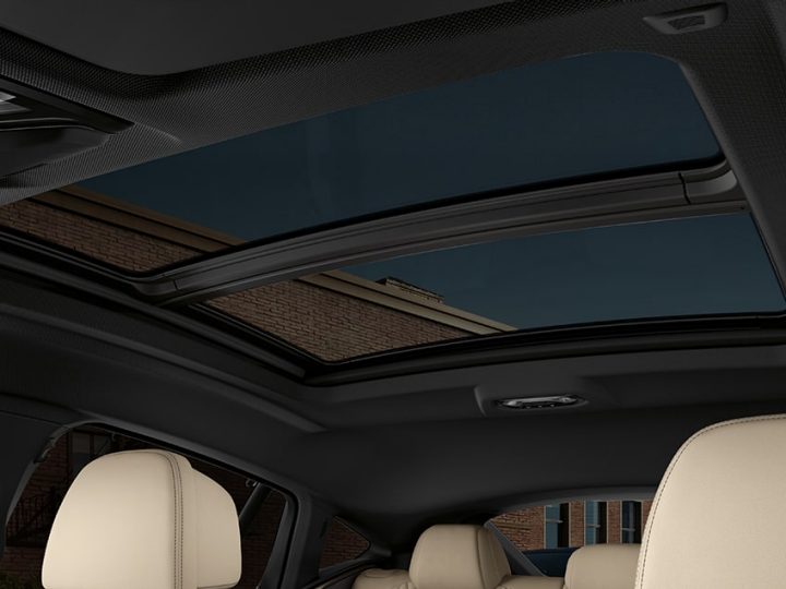 A detail shot of the stunning view of the sky from inside the 2026 BMW X6