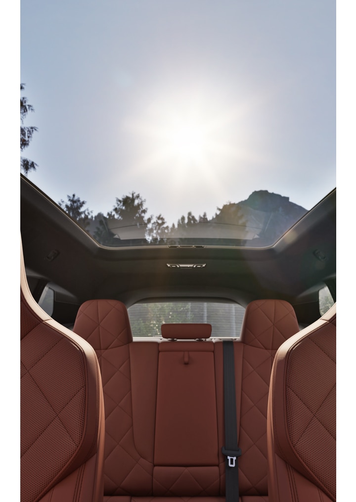 Interior of a BMW iX featuring split-fold down rear seats and voluminous cargo space